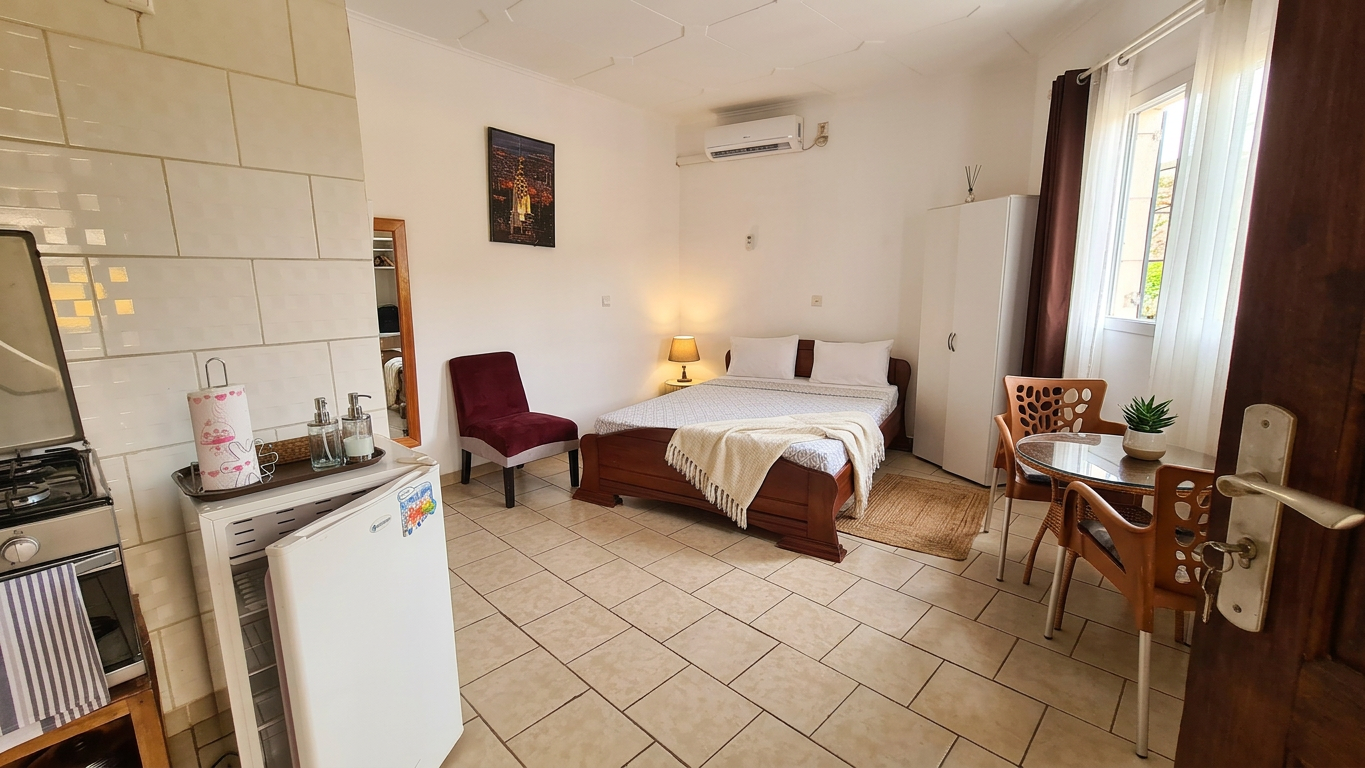 Chambre avec coin cuisine
